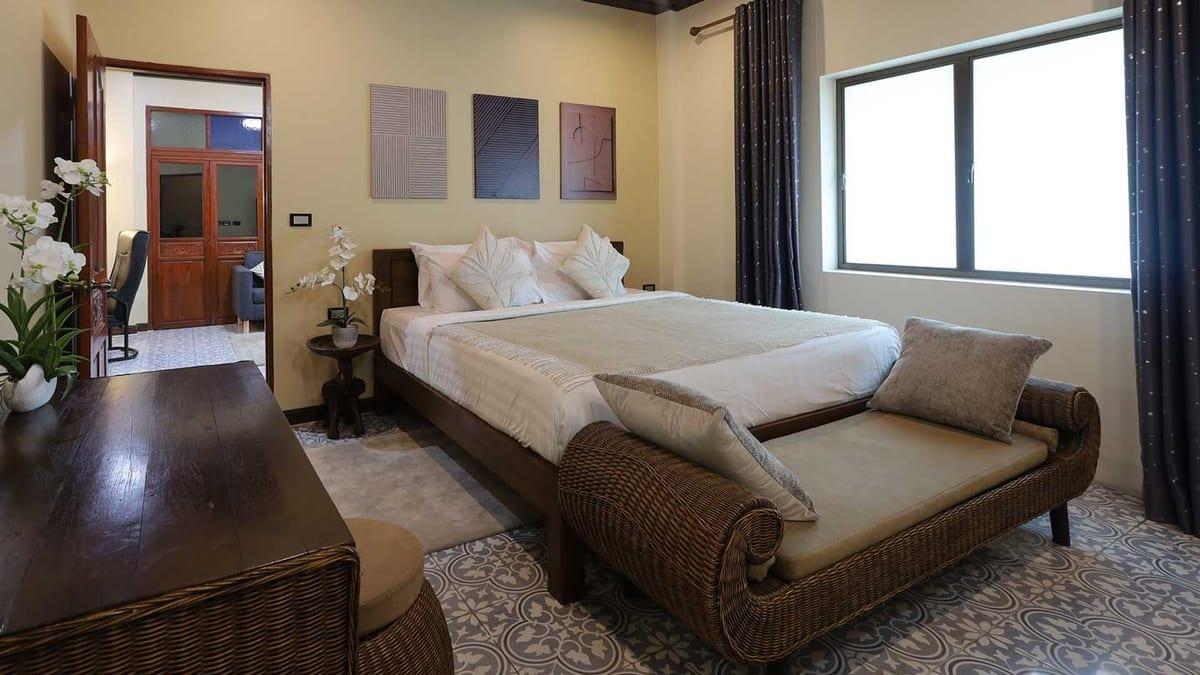 A made-up private client bedroom with a daybed and desk at Jintara Rehab Chiang Mai, held for a confirmed arrival date