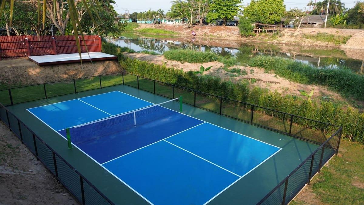 Pickleball court at Jintara Rehab in Chiang Mai with riverside setting