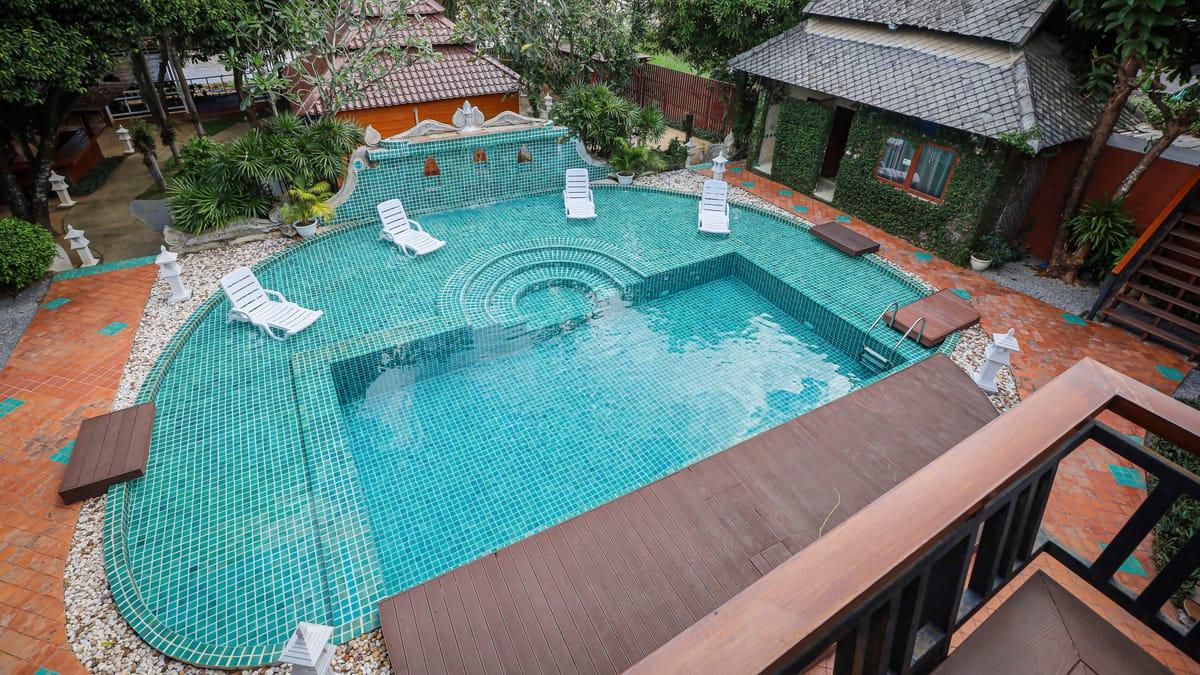 The pool and garden sala seen from a balcony at Jintara Rehab in Chiang Mai