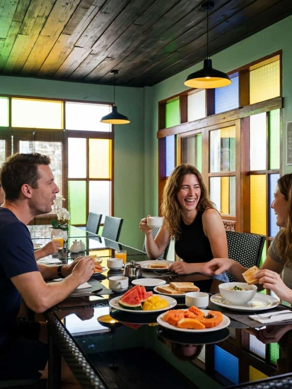 Clients at the shared breakfast table at Jintara Rehab Chiang Mai, with all meals included in the program fee