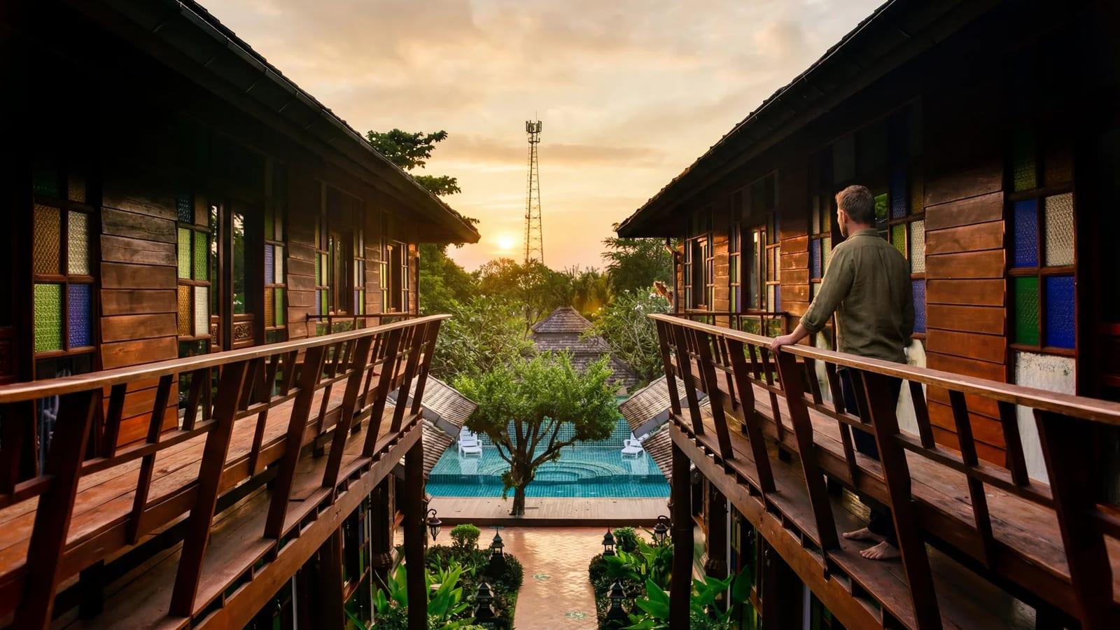 Timber walkways and central pool at a licensed residential rehab in Chiang Mai, Thailand