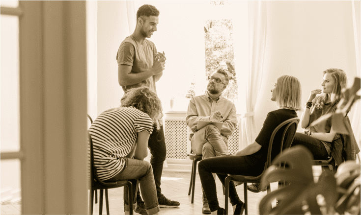 Group therapy session symbolizing mental health support and recovery.